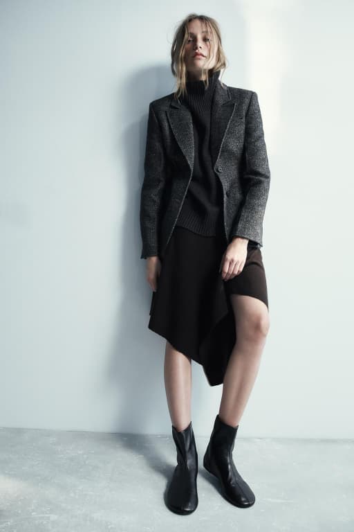 Asymmetric knit midi skirt